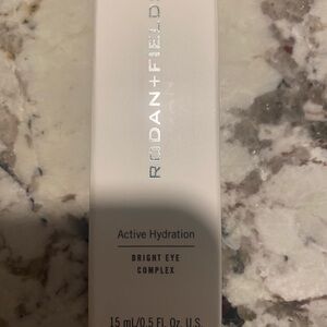 Rodan + Fields Bright Eye Complex in White and Silver